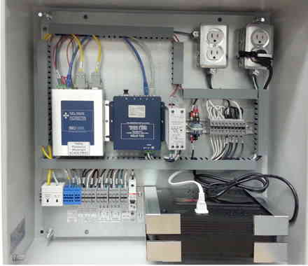 SCADA cabinet with wiring and components inside for grid interface.